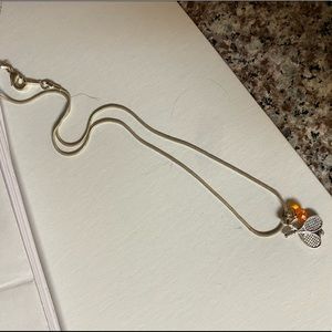 tennis necklace with orange charm